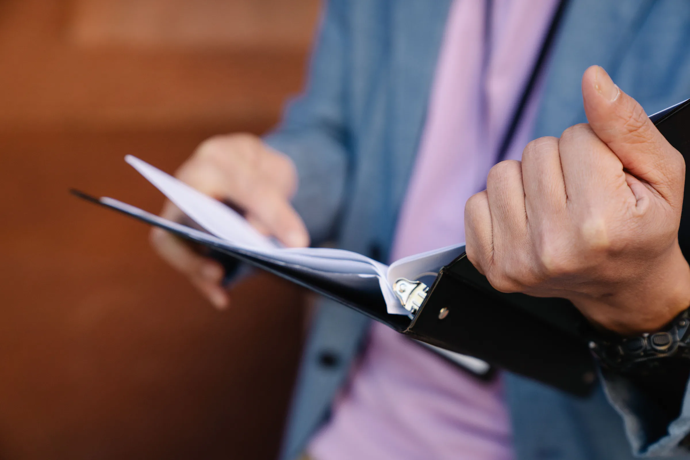 A worker using a printed procedure as an active reference