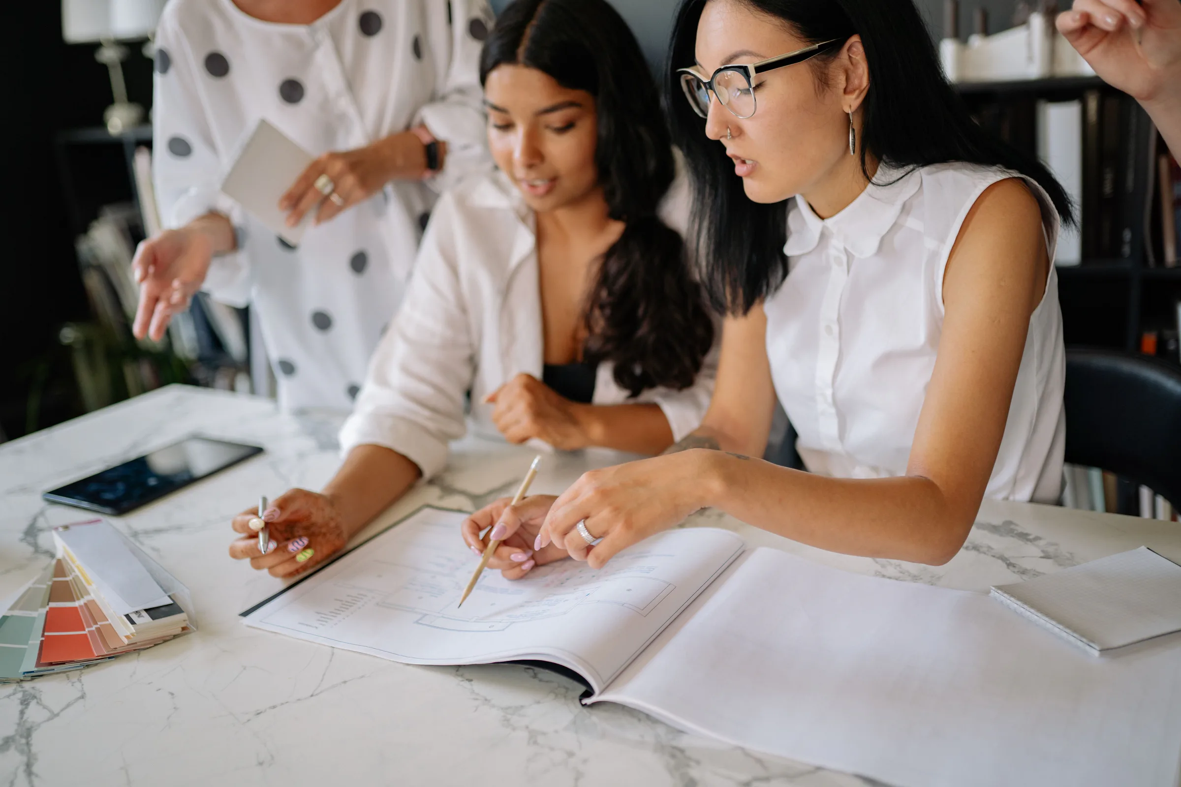 A consultant and business owner working through project details together